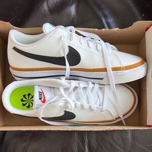 Brand new Nike White and Black Sneakers with Gold Trim!